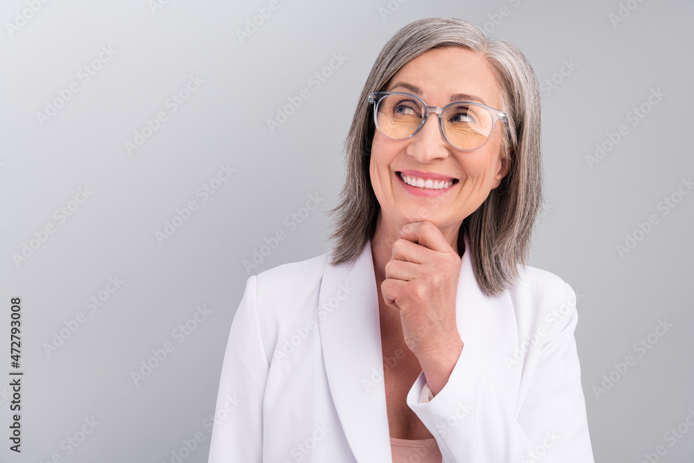 Photo of working white hairdo old lady think look empty space wear eyewear blazer isolated on grey color background