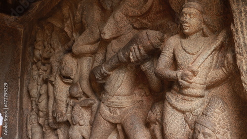 Mahishasuramartini Cave Temple. Stone carvings of Mahishan and Durga fighting scene. Located in the background of the rock.A side view