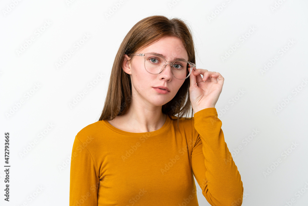Young English woman isolated on white background With glasses and frustrated expression Young English woman isolated on white background With glasses and frustrated expression