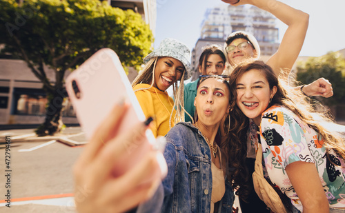 Vibrant young people taking a selfie together