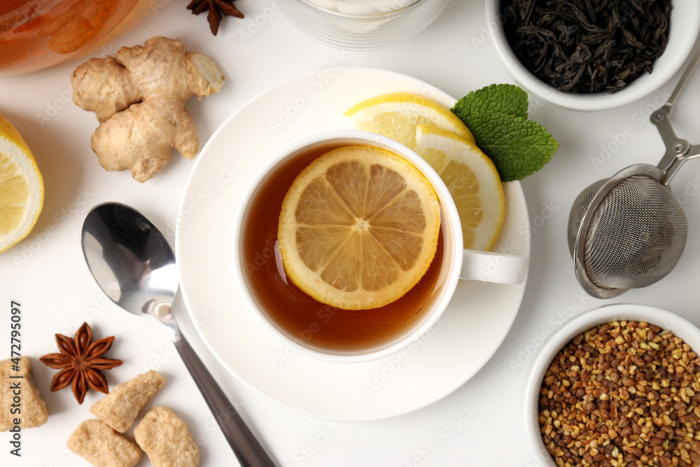 Concept of hot drink with tea on white background Concept of hot drink with tea on white background