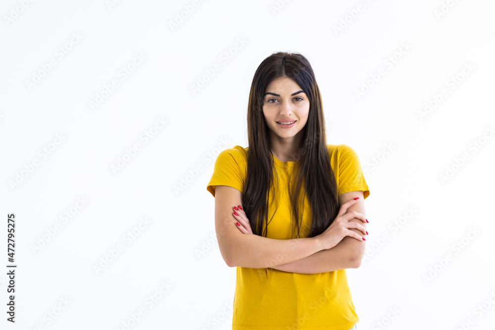 Portrait of a happy woman standing with arms folded on a white background Portrait of a happy woman standing with arms folded on a white background
