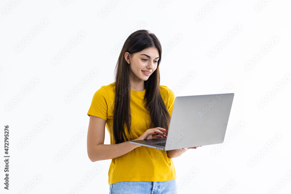 Portrait of a happy businesswoman working on laptop computer isolated over white background Portrait of a happy businesswoman working on laptop computer isolated over white background
