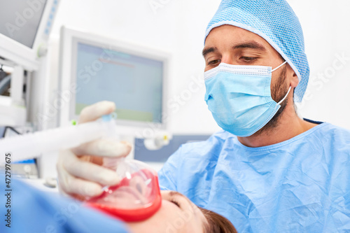 Concentrated anesthetist and patient during an operation