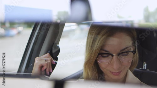 Wallpaper Mural Smiling successful blond woman in stylish eyeglasses fastening seatbelt sitting on driver seat in car, going for business in her new automobile, vehicle rent or purchase, femininity Torontodigital.ca