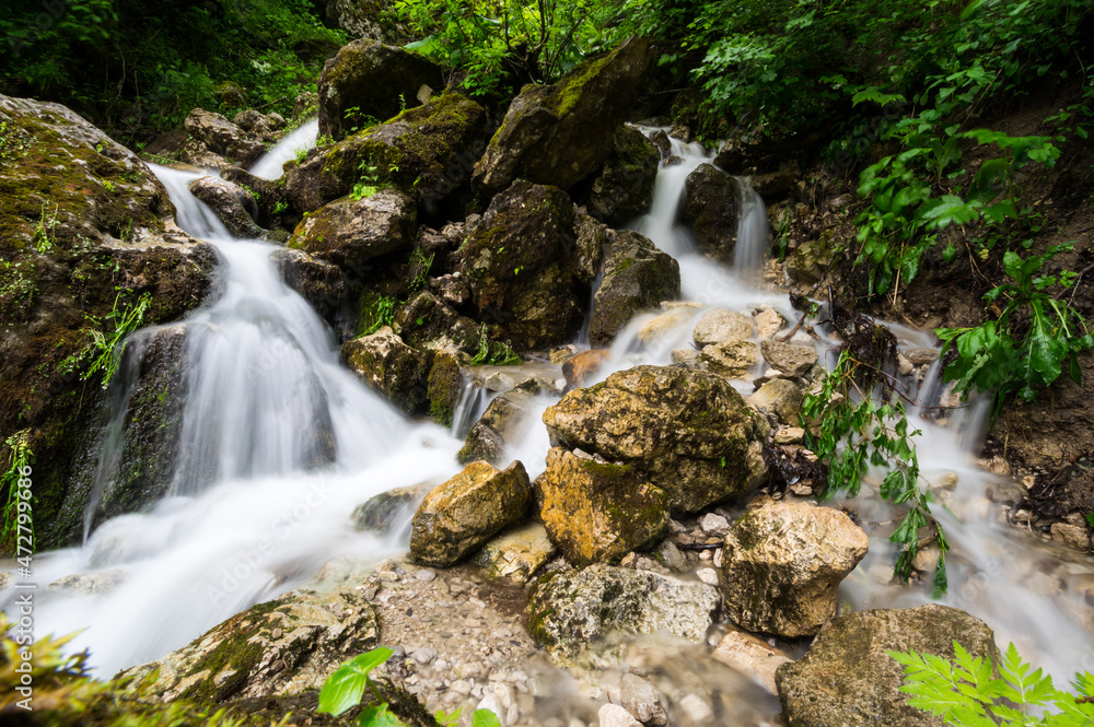 Waterfall in Cherek gorge in the Caucasus mountains in Russia Waterfall in Cherek gorge in the Caucasus mountains in Russia