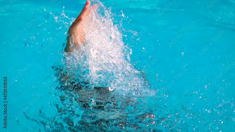 The child is drowning in water. Selective focus. The child is drowning in water. Selective focus.