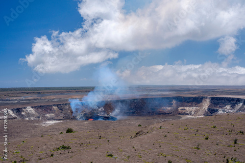 USA, Hawaii, Big Island of Hawaii. Hawaii Volcanoes National Park, Lava and steam eruption in Halemaumau Crater which is located within Kilauea Crater. photo