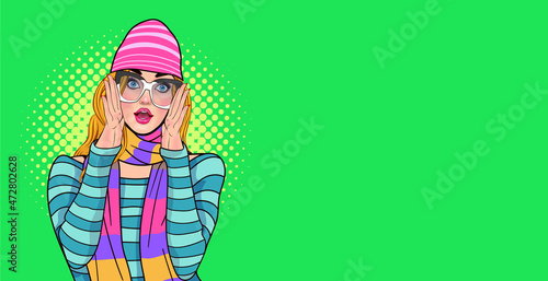 Surprised woman in glasses with scarf and woolen hat face wow raising hand to her cheek