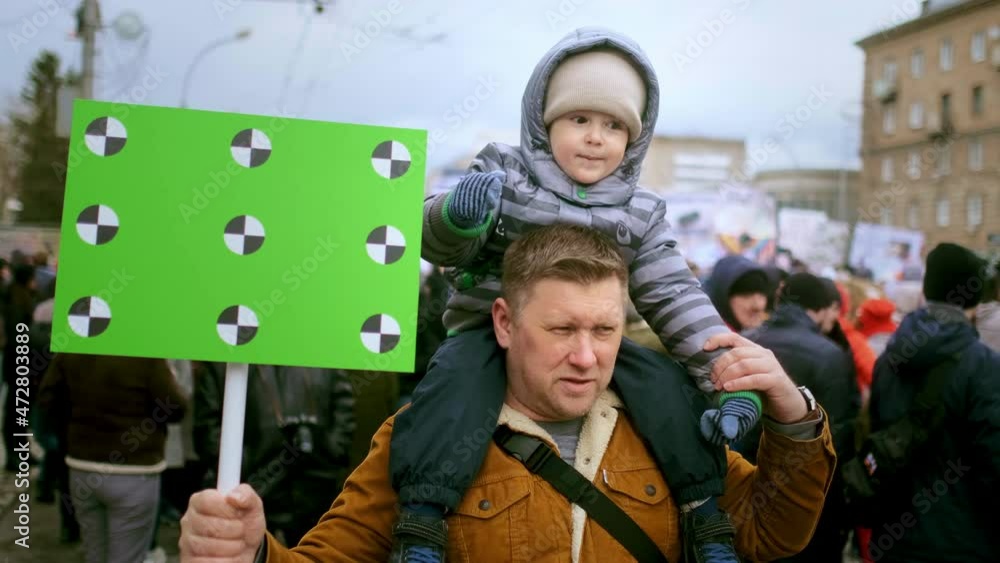 Video „Family of protesting father and son with chroma key space banner ...