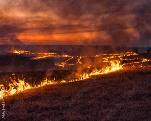 Burring of the Flint Hills keeps the underbrush and grass down and prevents build up of dried plants that can cause very large prairie fires.