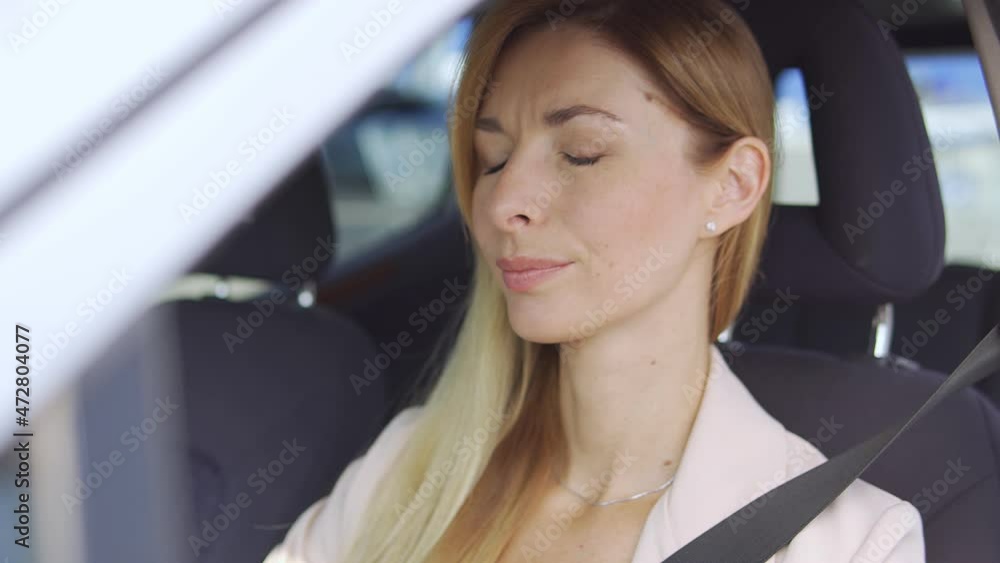 Exhausted woman putting off eyeglasses sitting in car, leaning head on hand, feeling tiredness, burdened with housework and work responsibilities, vitamin deficiency and emotional burnout Exhausted woman putting off eyeglasses sitting in car, leaning head on hand, feeling tiredness, burdened with housework and work responsibilities, vitamin deficiency and emotional burnout