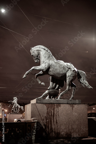 Obraz na płótnie Sculpture of a horse on the famous Anichkov Bridge in St. Petersburg w salonie