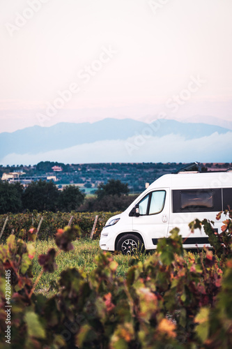 Campervan and vineyard in autumn colors