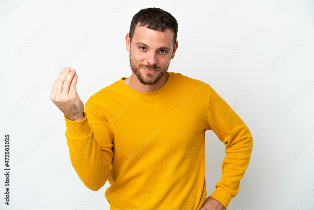 Young Brazilian man isolated on white background making Italian gesture Young Brazilian man isolated on white background making Italian gesture