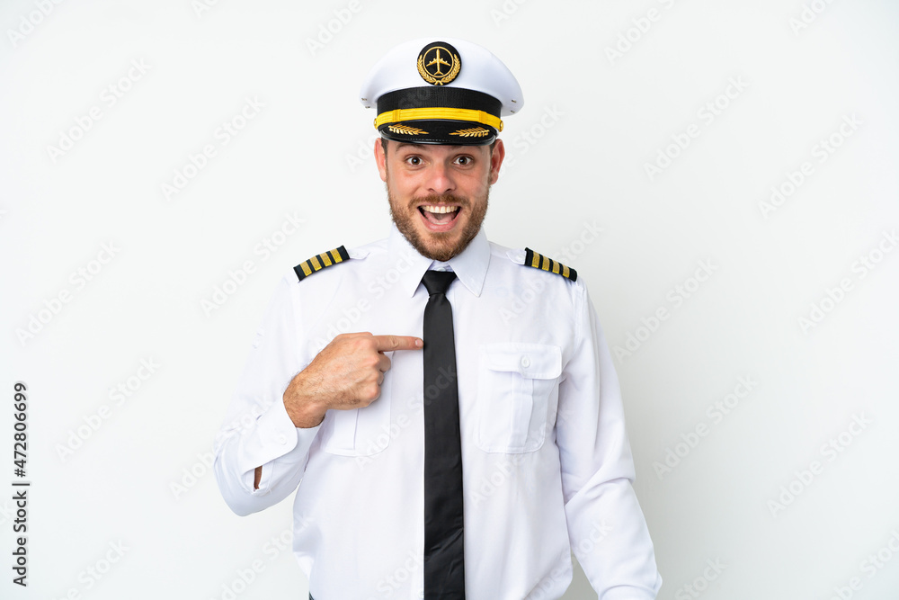 Airplane Brazilian pilot isolated on white background with surprise facial expression