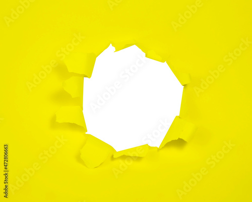 Yellow paper with hole isolated background with copy space