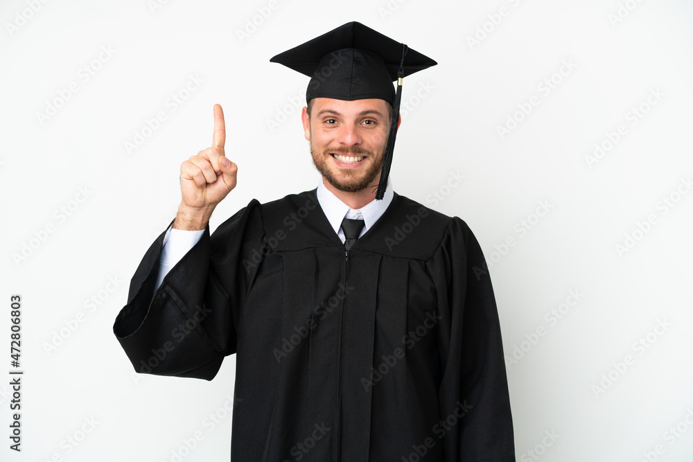 Young university Brazilian graduate isolated on white background pointing up a great idea Young university Brazilian graduate isolated on white background pointing up a great idea