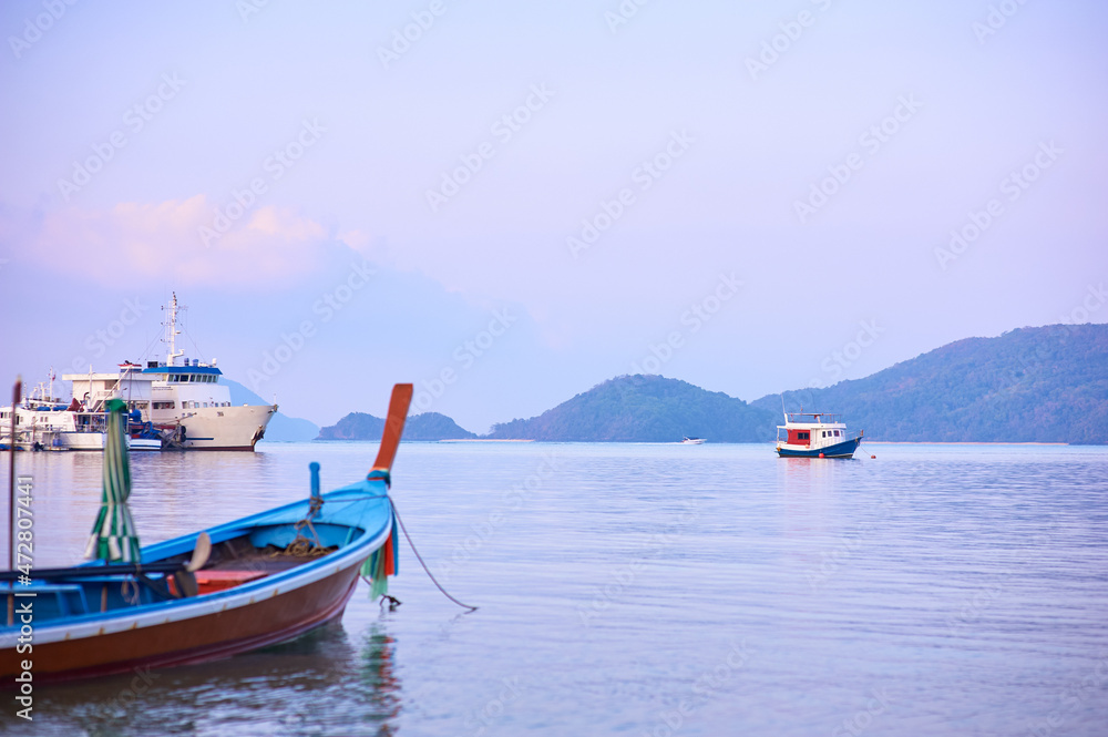 Travel by Thailand. Landscape with traditional longtail fishing boat on the sea beach.