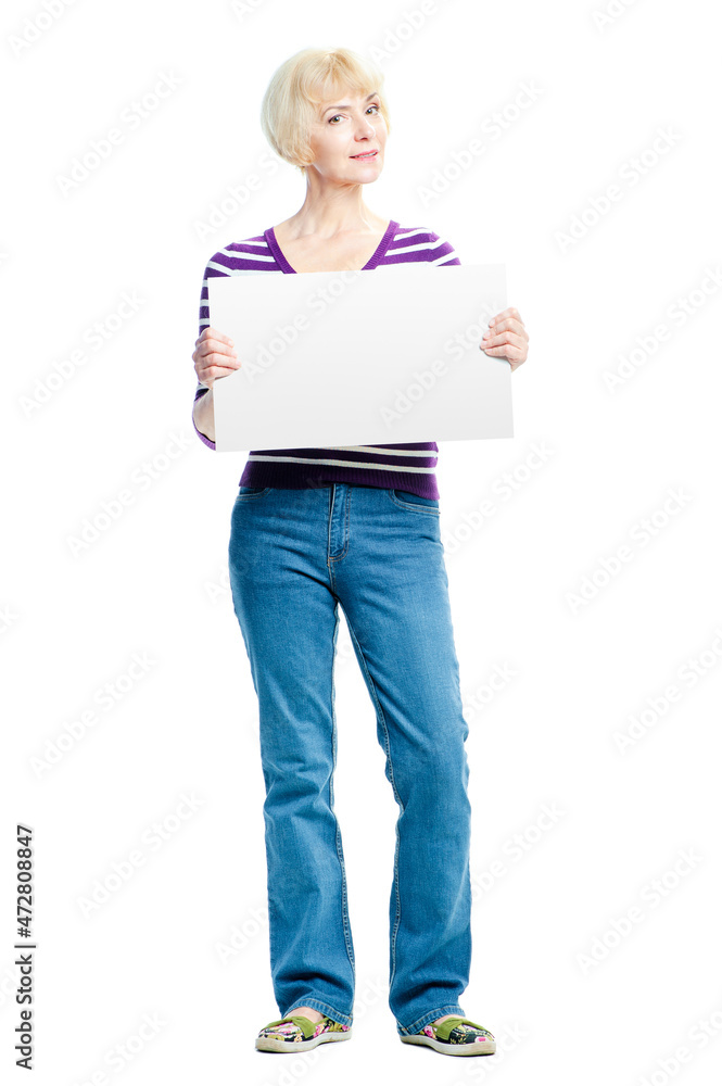Your advertisement in good hands. Attractive middle aged woman holding empty blank with copy space. Isolated on white.