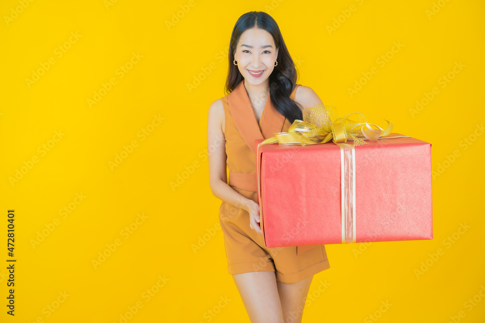 Portrait beautiful young asian woman smile with red gift box Portrait beautiful young asian woman smile with red gift box