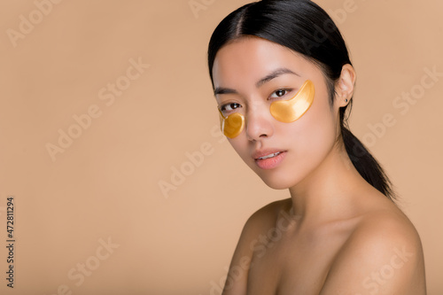 Fototapeta Gold eye patches for puffiness, wrinkles and dark circles, skincare concept