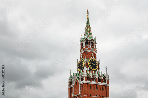 Photography Kremlin tower against heavy gray clouds. Moscow, Russia.