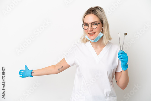 Dentist caucasian woman holding tools isolated on white background extending hands to the side for inviting to come