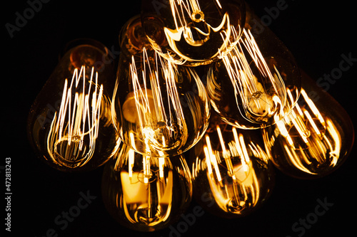Fotobehang Warm light bulb, close up of filaments inside