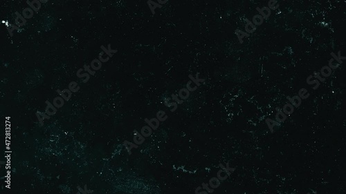Looping dark grunge grit overlay. Low framerate animated texture. This overlay can be used in Screen Blending Mode to remove black background. photo