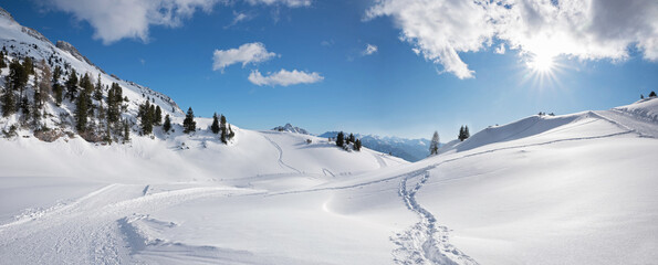 stunning winter landscape Rofan alps, with ski piste and foot tracks