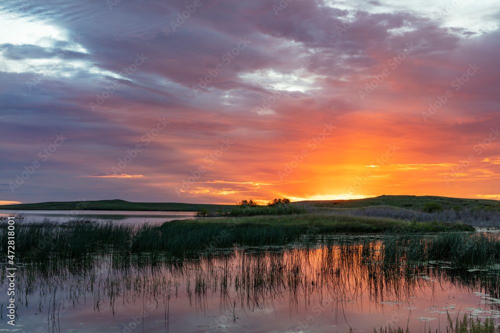 Sunrise over Anderson Lake on the Rocky Mountain Front near Augusta, Montana, USA Sunrise over Anderson Lake on the Rocky Mountain Front near Augusta, Montana, USA
