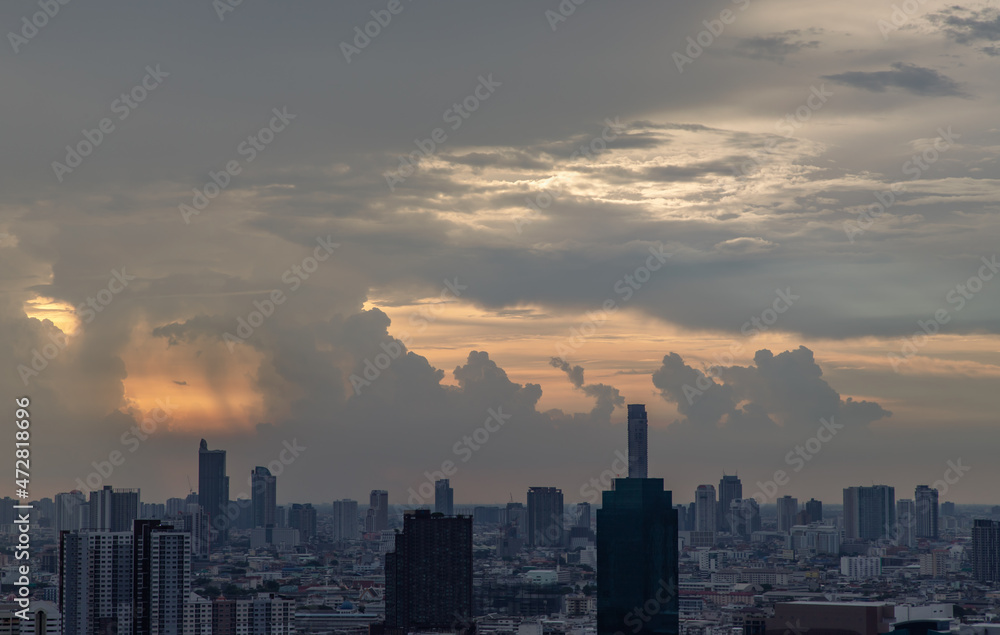 Bangkok, Thailand - Mey18, 2021 : Gorgeous panorama scenic of the sunrise or sunset with cloud on the orange and blue sky over large metropolitan city in Bangkok. Copy space, No focus, specifically. Bangkok, Thailand - Mey18, 2021 : Gorgeous panorama scenic of the sunrise or sunset with cloud on the orange and blue sky over large metropolitan city in Bangkok. Copy space, No focus, specifically.