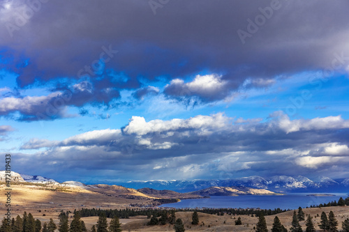 Late afternoon light on Flathead Lake and Mission Range during mild winter in Elmo, Montana, USA photo