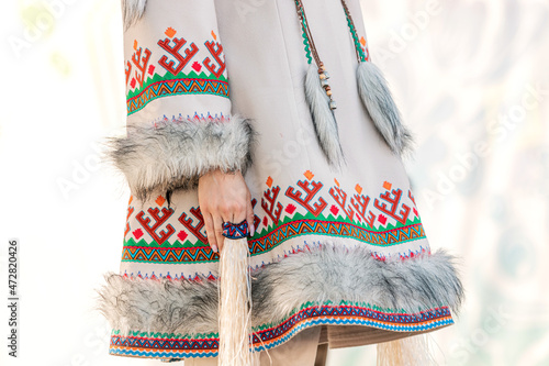 Traditional clothing of the indigenous peoples of the north. Coat richly decorated with deer fur and national patterns