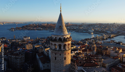 Aerial view of Galata Tower and the Golden Horn junction with Bosphorus strait in Istanbul, Turkey, during sunset.