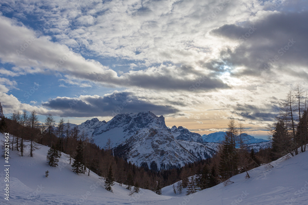 Sunset panorama of Mount Civetta with the top covered by clouds. Fiorentina Valley, Dolomites, Italy