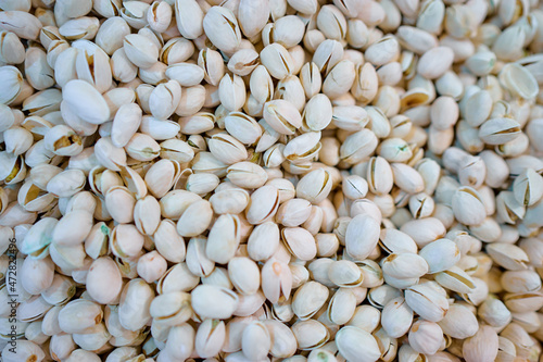 Pistachios for sale on market. Agriculture background. Close-up. Top view. photo