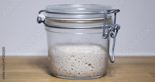sourdough starter on kitchen table 