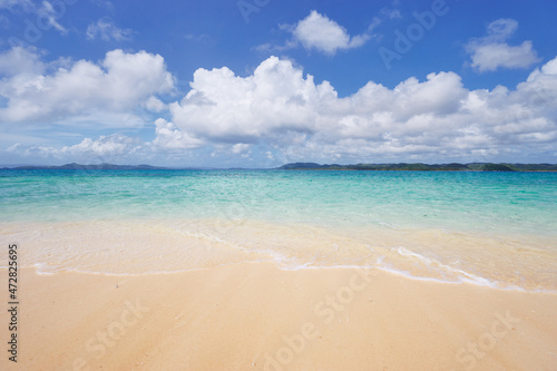 Beautiful seascape. Sandy beach with blue clear water.