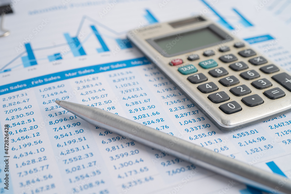 Calculator on preadsheet table paper with graph. Finance development, Banking Account, Statistics Investment Analytic research data economy, trading, office reporting Business company meeting concept. Calculator on preadsheet table paper with graph. Finance development, Banking Account, Statistics Investment Analytic research data economy, trading, office reporting Business company meeting concept.
