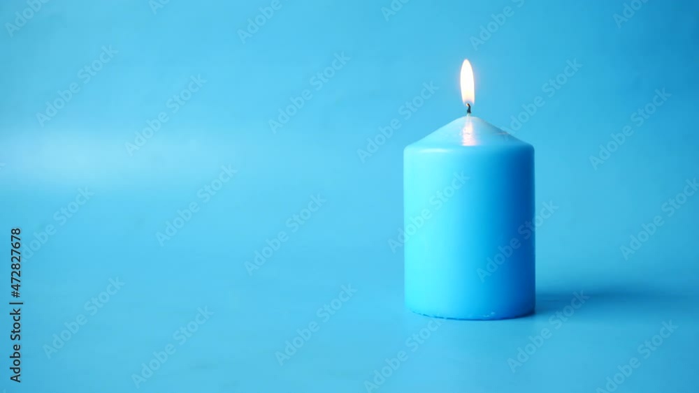 blue color candles slowly burning down. blue color candles slowly burning down.