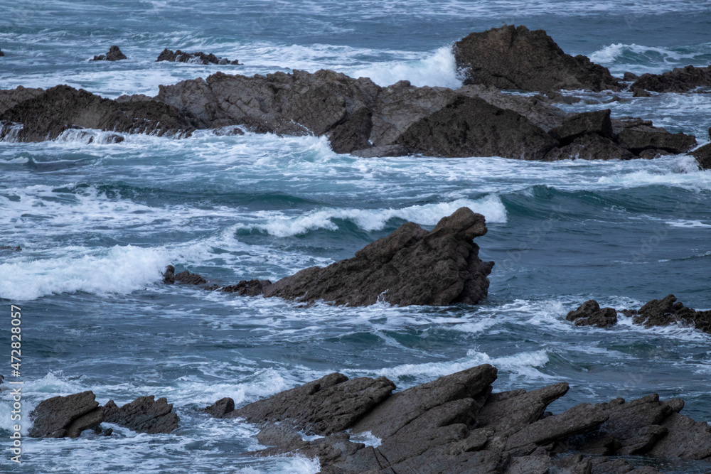 rocks on the coast of the Basque country in the village of Sopelana on a winter day