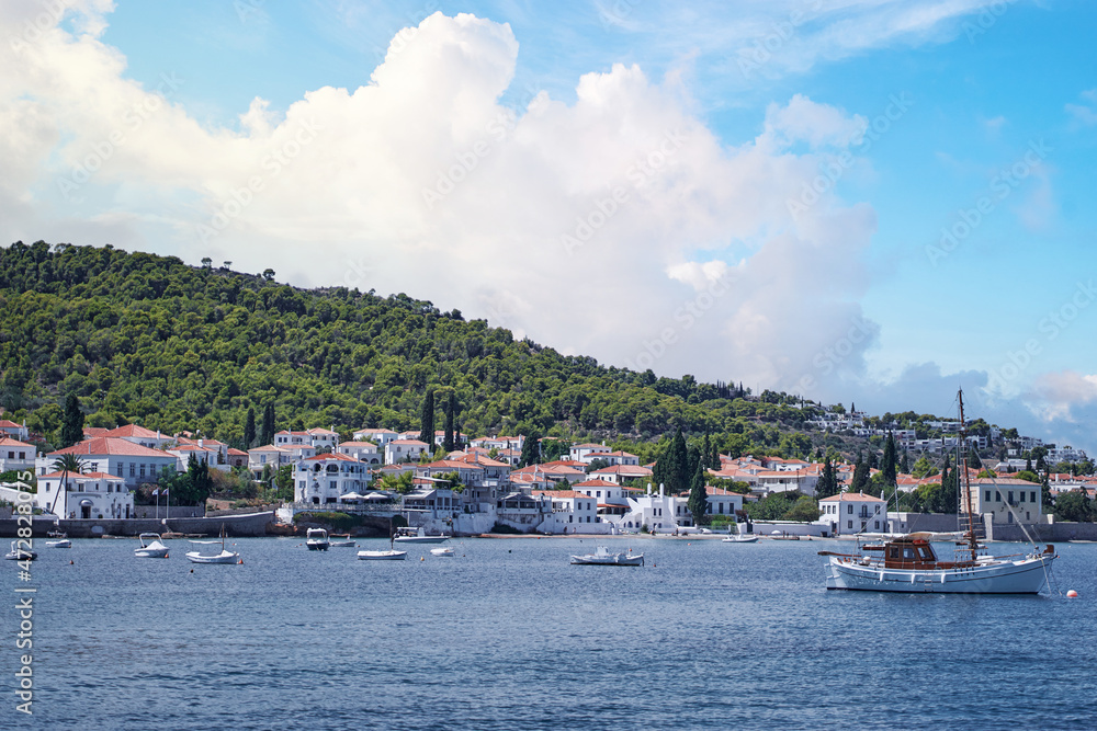 Spetses Island coast in Greece. A famous tourist destination on the Aegean sea. Old town and harbour view.