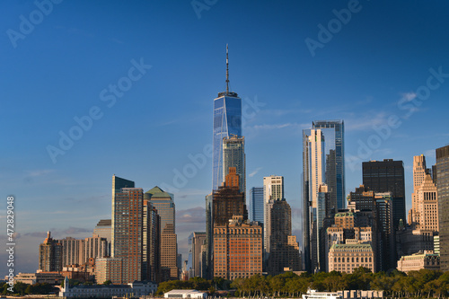 Skyline of Manhattan with its tall skyscraper buildings before sunrise. Visit New York, travel to America. One of the best places to see.