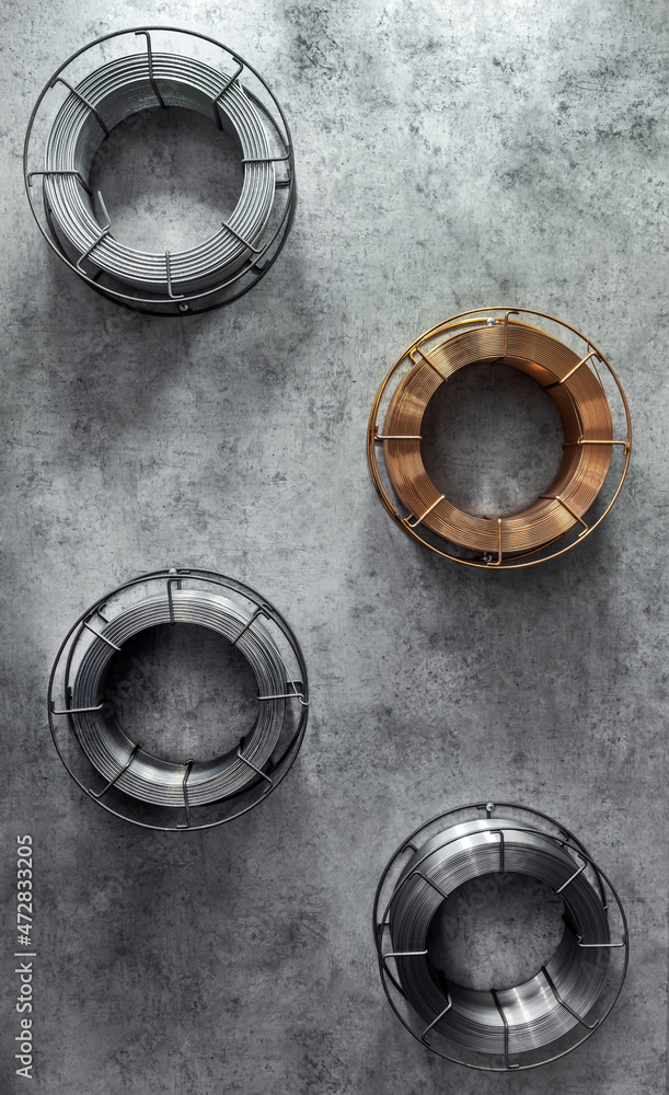coils with copper and steel wire on a dark coils with copper and steel wire on a dark