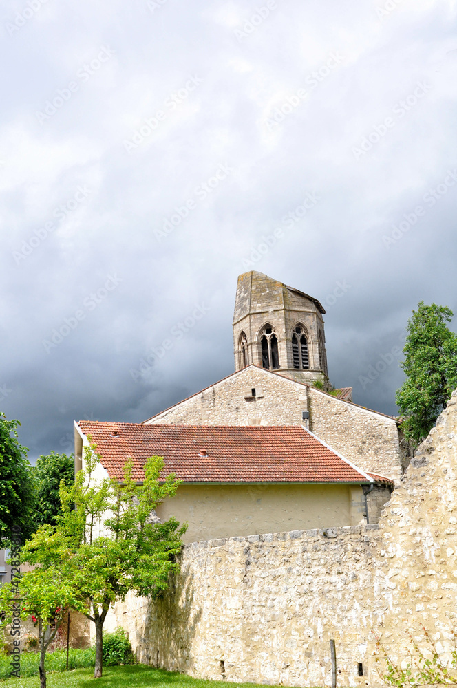 Fototapeta premium View of the Church of Saint-Jean-Baptiste in the village of Charroux, a medieval town, nestled in the heart of the Bourbonnais and classified as one of the most beautiful villages in France