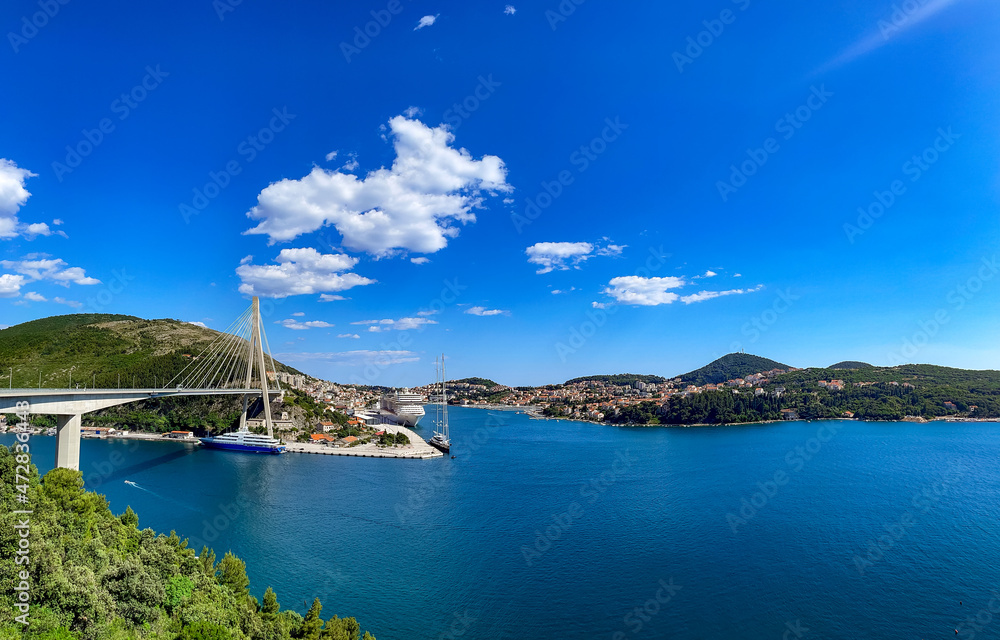 Panoramic photo with a view of the bay, bridge and cruise ship in Croatia, Dubrovnik.