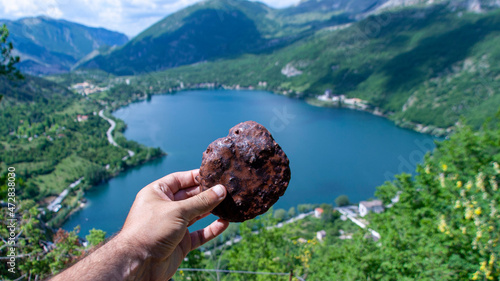 The famous heart-shaped lake of Scanno is a jewel set in the heart of Italy, between the Marsicani Mountains, in the upper valley of the Sagittario River, in Abruzzo photo