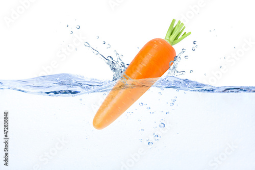 carrot in water splash © NIKCOA